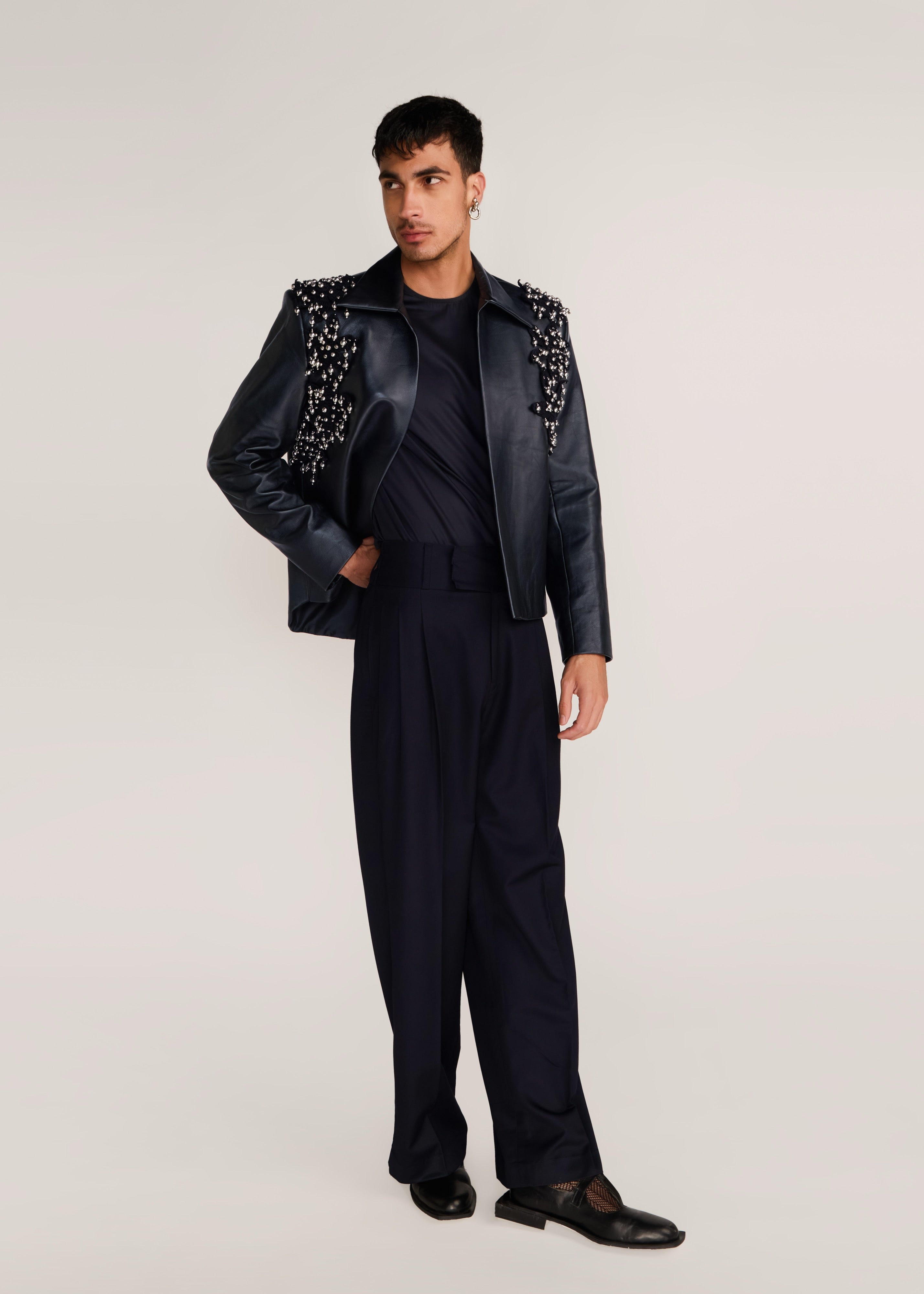 ROSANI The Samklang jacket in obsidian - obsidian leather jacket with hand-crocheted botanical shoulders, front view