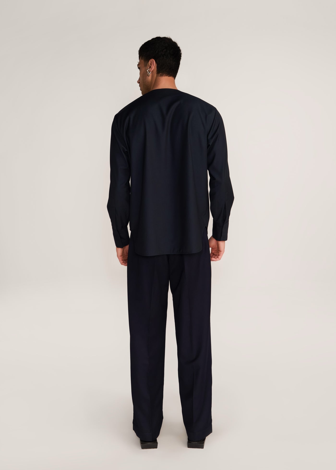 ROSANI The Sammen shirt in obsidian - obsidian round-neck snap-button shirt, back view