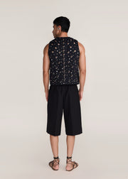 ROSANI The Synra vest in black denim - black denim eyelet and button embroidered vest, back view