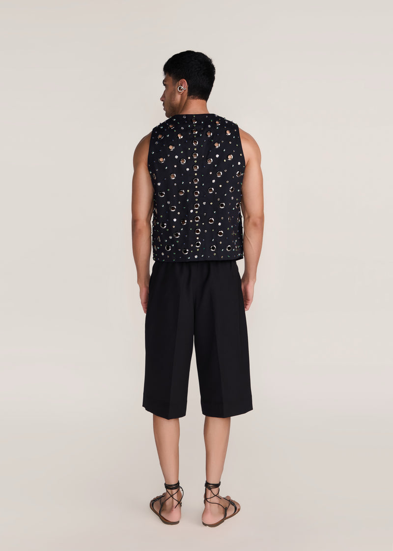 ROSANI The Synra vest in black denim - black denim eyelet and button embroidered vest, back view