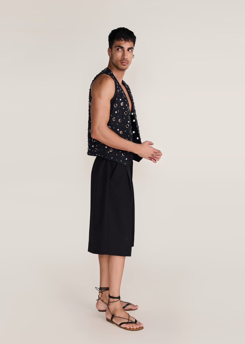 ROSANI The Synra vest in black denim - black denim eyelet and button embroidered vest, side view