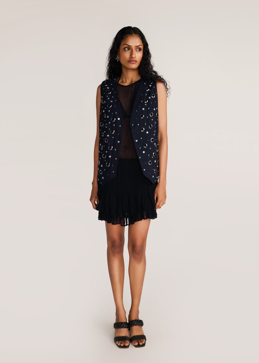 ROSANI The Synra vest in black denim - black denim eyelet and button embroidered vest, front view