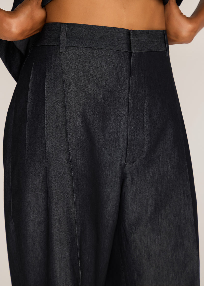 ROSANI The Taqārub trouser in charcoal - charcoal pleated cotton-polyester denim trouser, front view