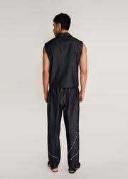 ROSANI The Ubuntu vest in charcoal - charcoal denim vest with asymmetric collar and placket, back view