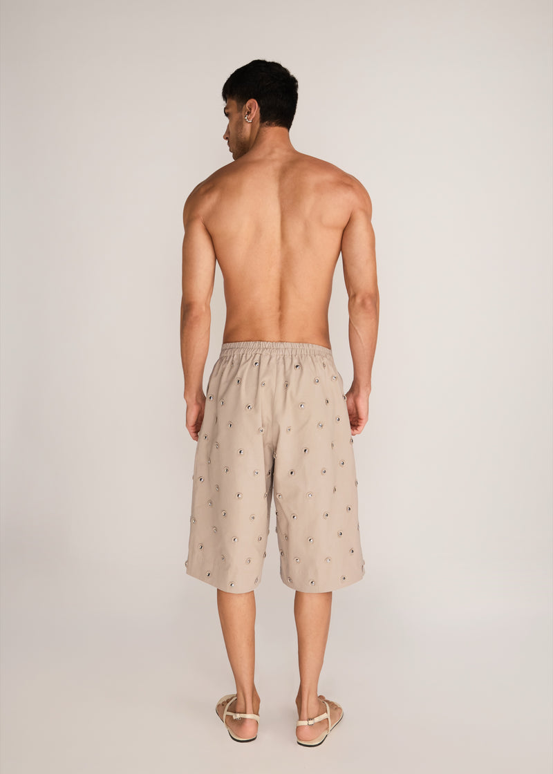ROSANI The Unio shorts in sand dune - sand dune cotton laser-cut chrome embroidered shorts, back view