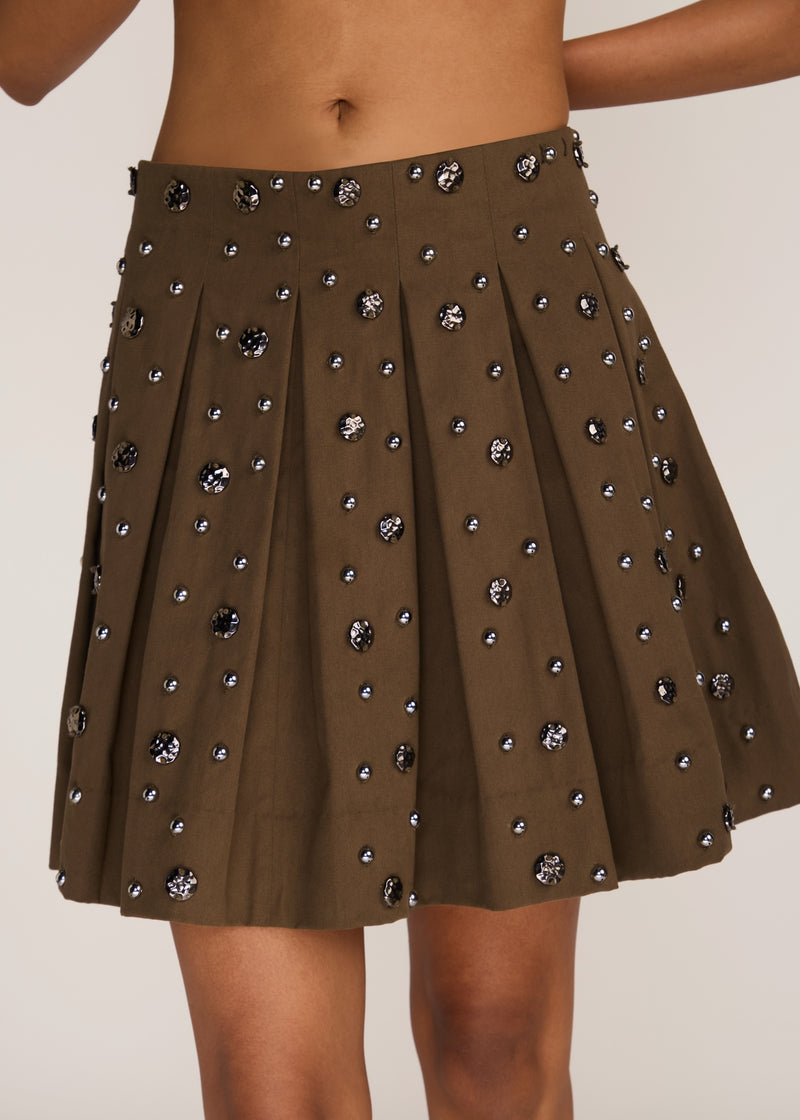 ROSANI The Virel skirt in deep olive - deep olive all-round pleated skirt with antique metallic embroidery, front view