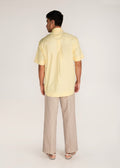 ROSANI The Yūgō shirt in pale lemon - pale lemon laser-cut shirt with hand-stitched black knots, back view
