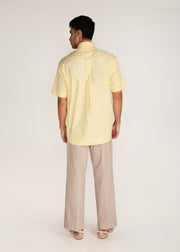 ROSANI The Yūgō shirt in pale lemon - pale lemon laser-cut shirt with hand-stitched black knots, back view