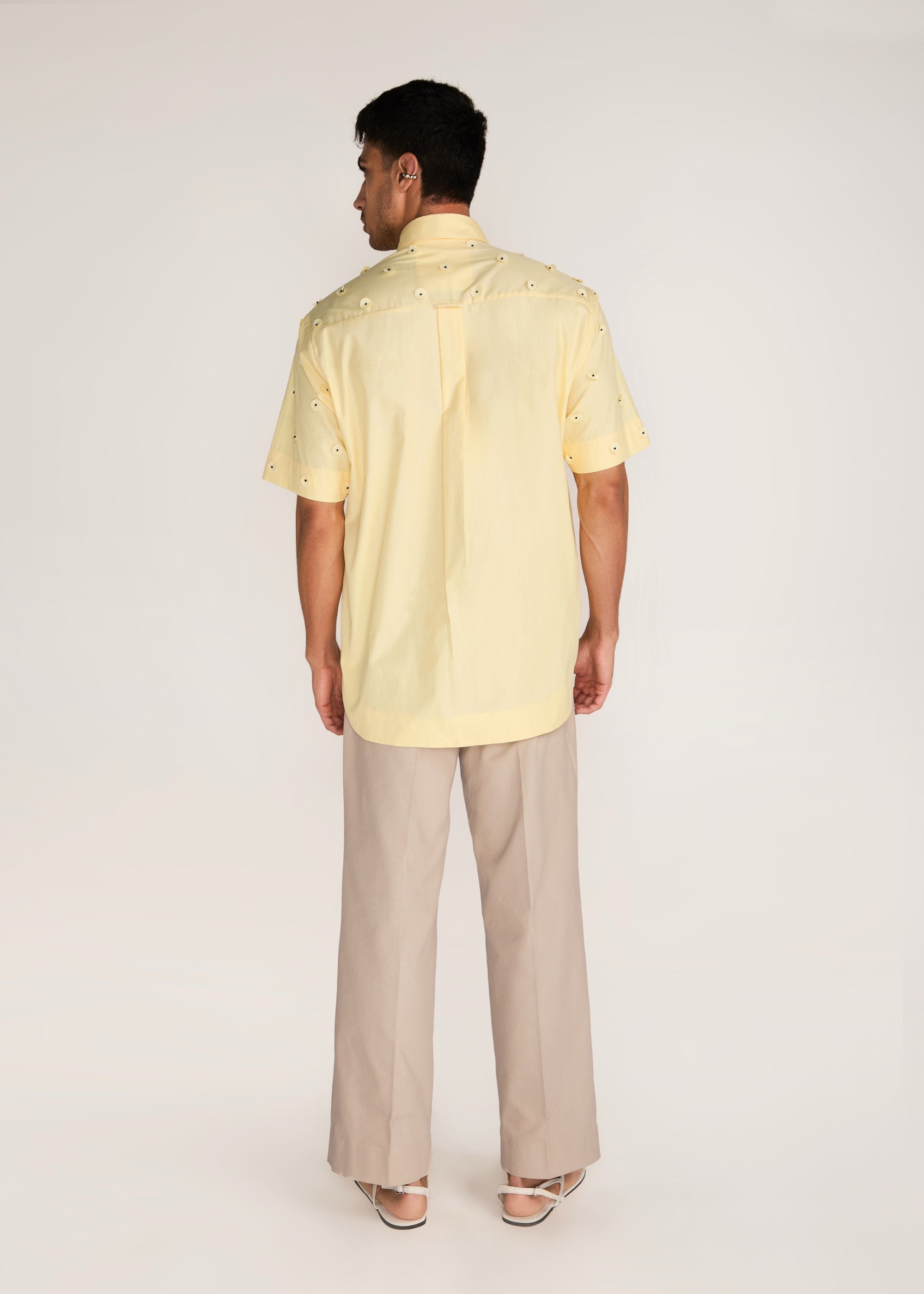ROSANI The Yūgō shirt in pale lemon - pale lemon laser-cut shirt with hand-stitched black knots, back view