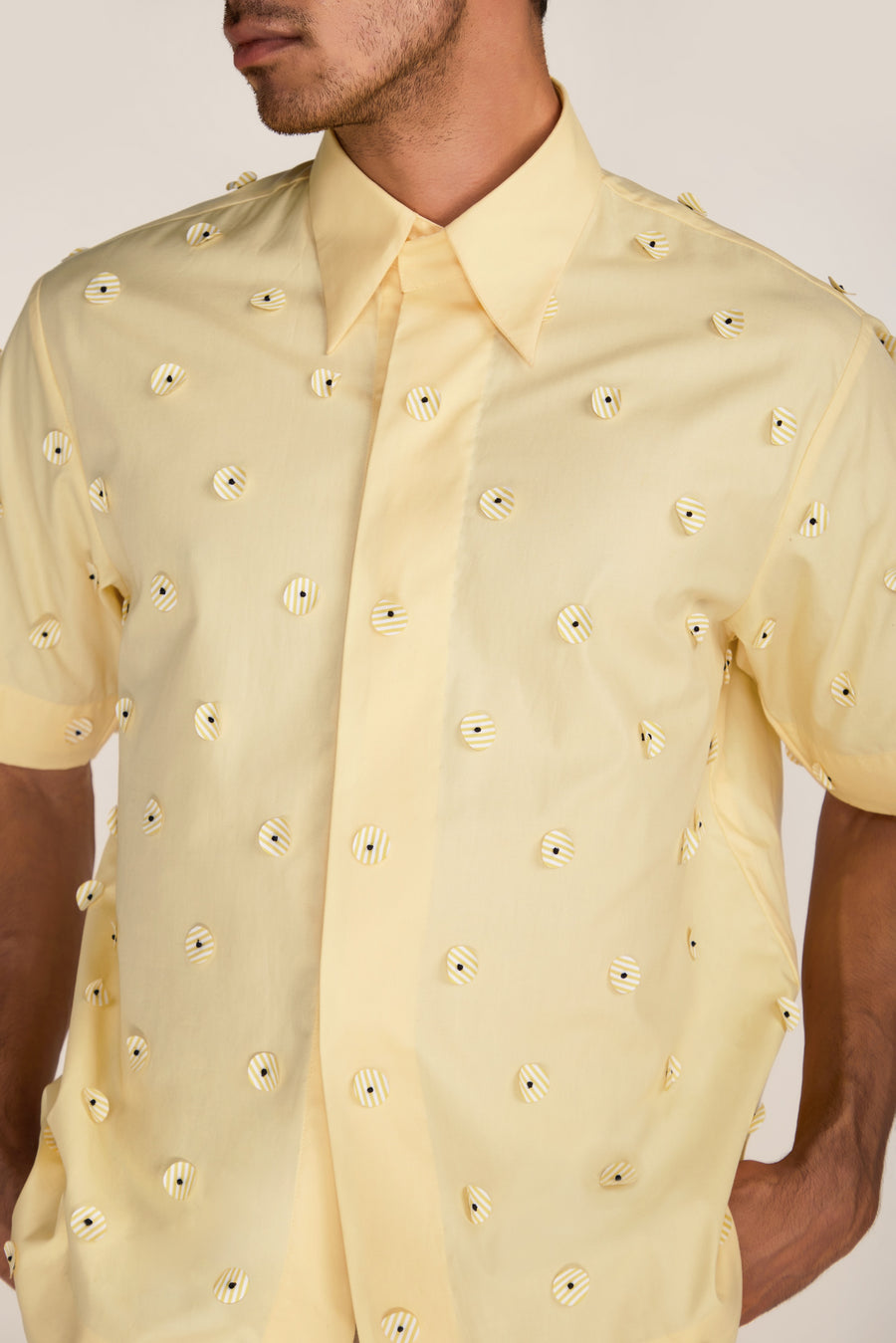 ROSANI The Yūgō shirt in pale lemon - pale lemon laser-cut shirt with hand-stitched black knots, craft detail