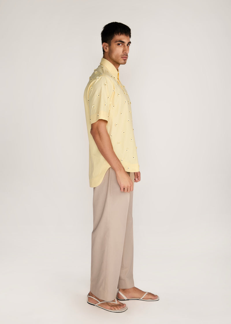 ROSANI The Yūgō shirt in pale lemon - pale lemon laser-cut shirt with hand-stitched black knots, side view
