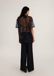 ROSANI The Zephyr tunic in black - black crisp organza tunic with sequin and metallic accents, back view
