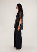 ROSANI The Zephyr tunic in black - black crisp organza tunic with sequin and metallic accents, side view