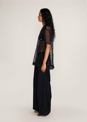ROSANI The Zephyr tunic in black - black crisp organza tunic with sequin and metallic accents, side view