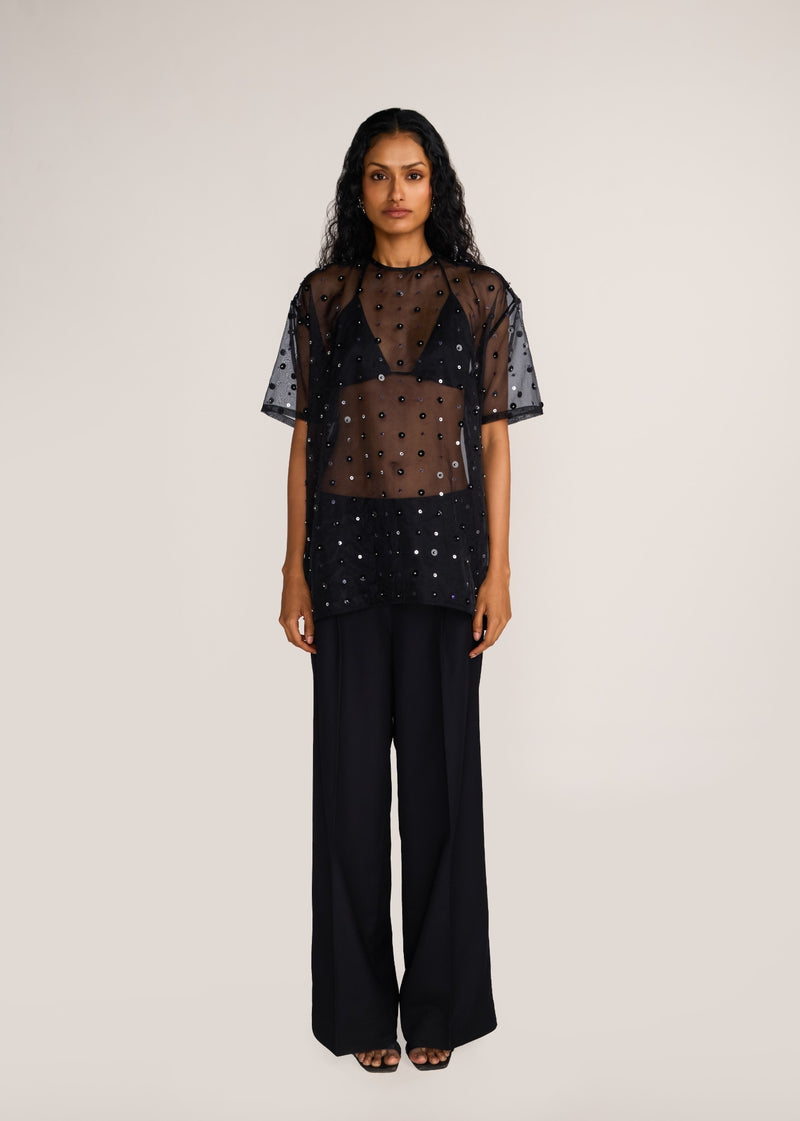 ROSANI The Zephyr tunic in black - black crisp organza tunic with sequin and metallic accents, front view