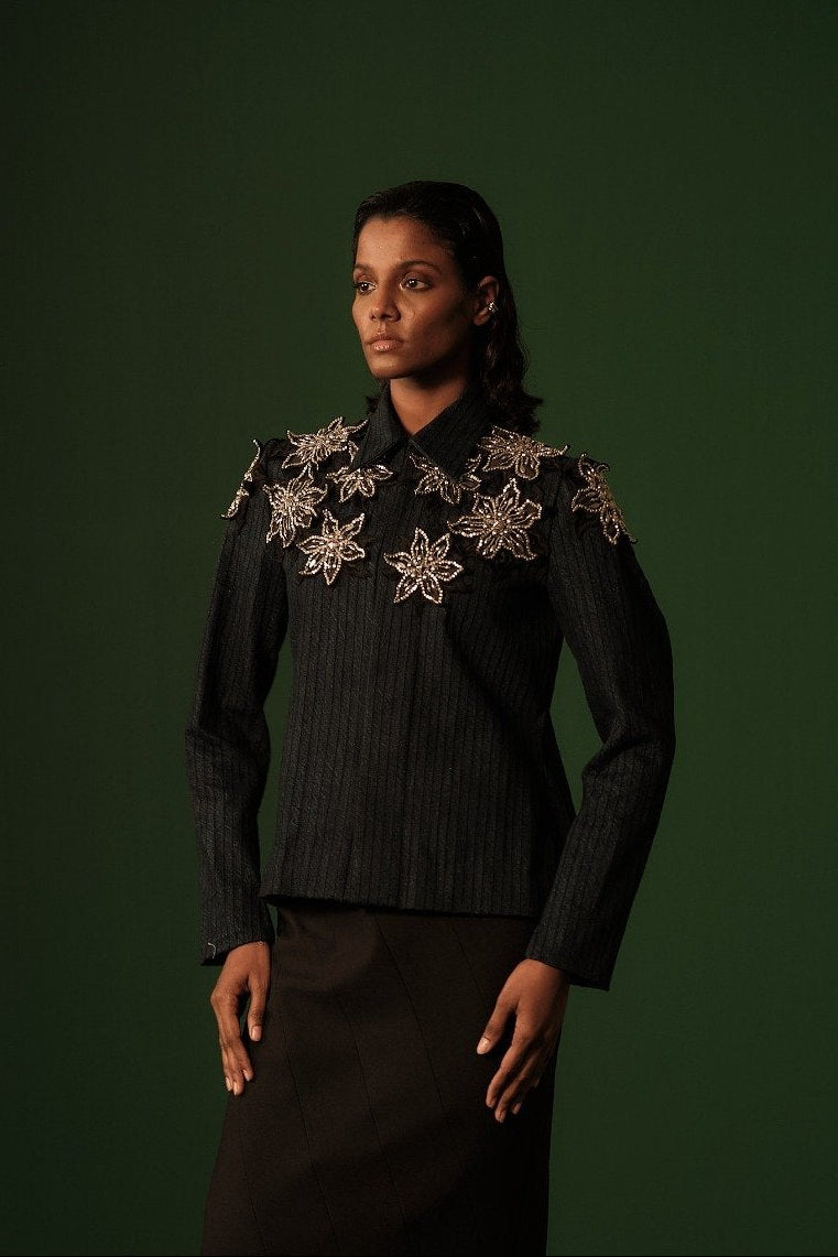 ROSANI The Lero jacket in midnight denim - anchor-thread stitched denim jacket with metallic floral patch embellishments, editorial front view