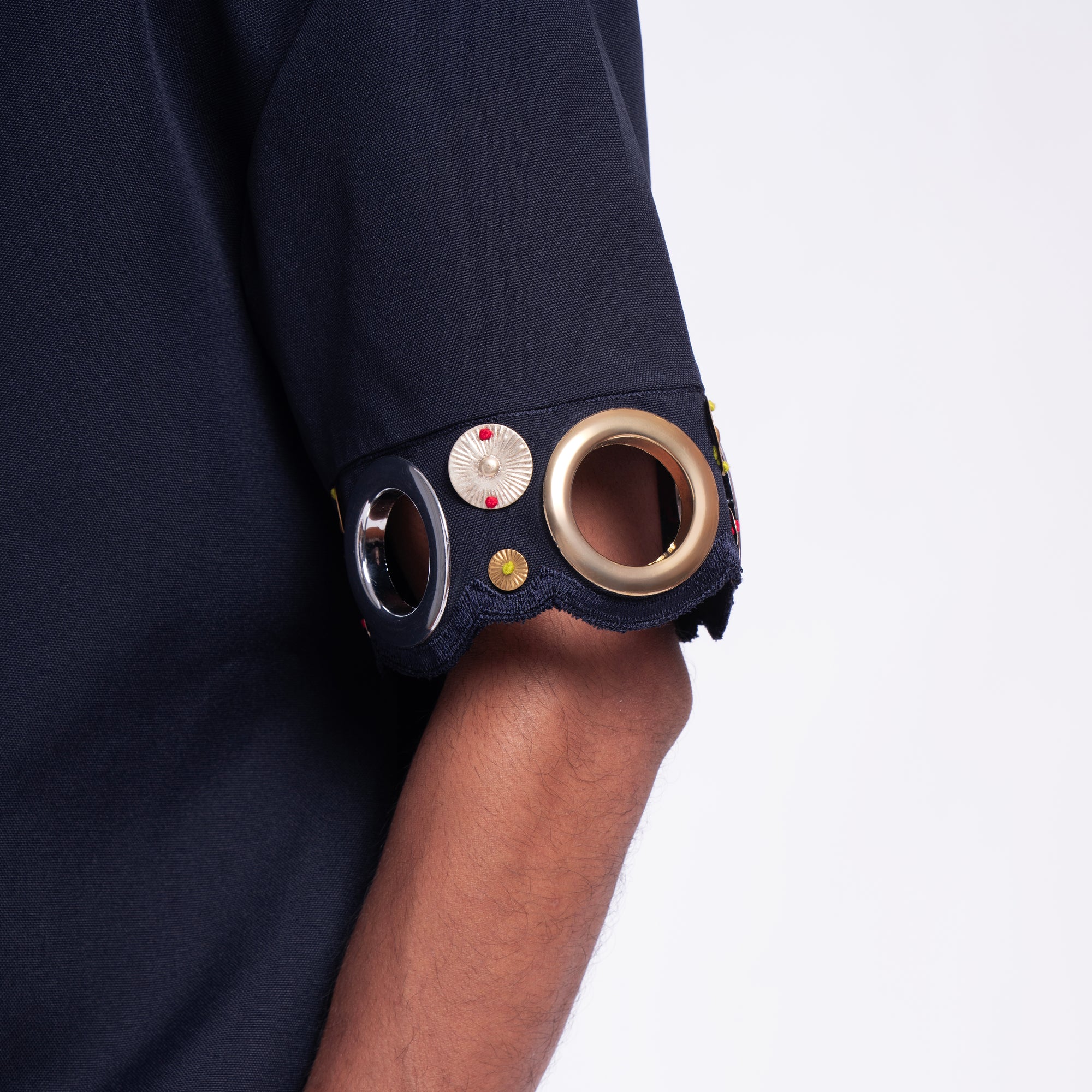 ROSANI The Alti shirt in navy. Metallic ring sleeve accent, detail view.