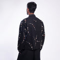 ROSANI The Arnos jacket in black, back view. Relaxed silhouette. DYMENSION collection.