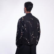 ROSANI The Arnos jacket in black, back view. Relaxed silhouette. DYMENSION collection.