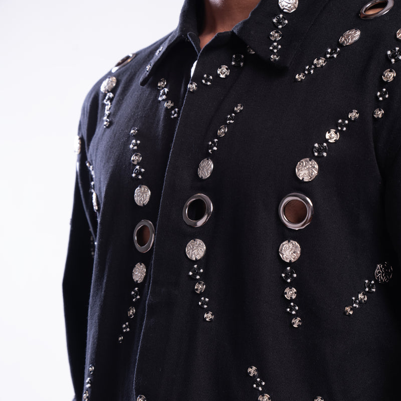 ROSANI The Arnos jacket, detail view of hand-placed metallic eyelets and magnetic press button embellishment.