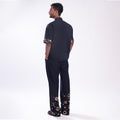 ROSANI The Aryom trouser in blue, back view. Back elastic waist construction.