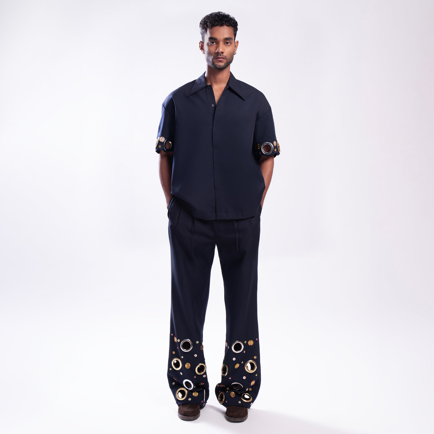 ROSANI The Aryom trouser in blue, full-front view showing wide-leg silhouette and double pleat construction.