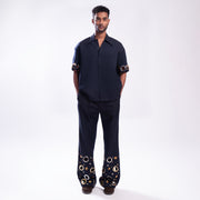 ROSANI The Aryom trouser in blue, full-front view showing wide-leg silhouette and double pleat construction.
