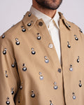 ROSANI The Carter jacket in khaki. Close-up of metallic eyelet and sequin embellishment detail.