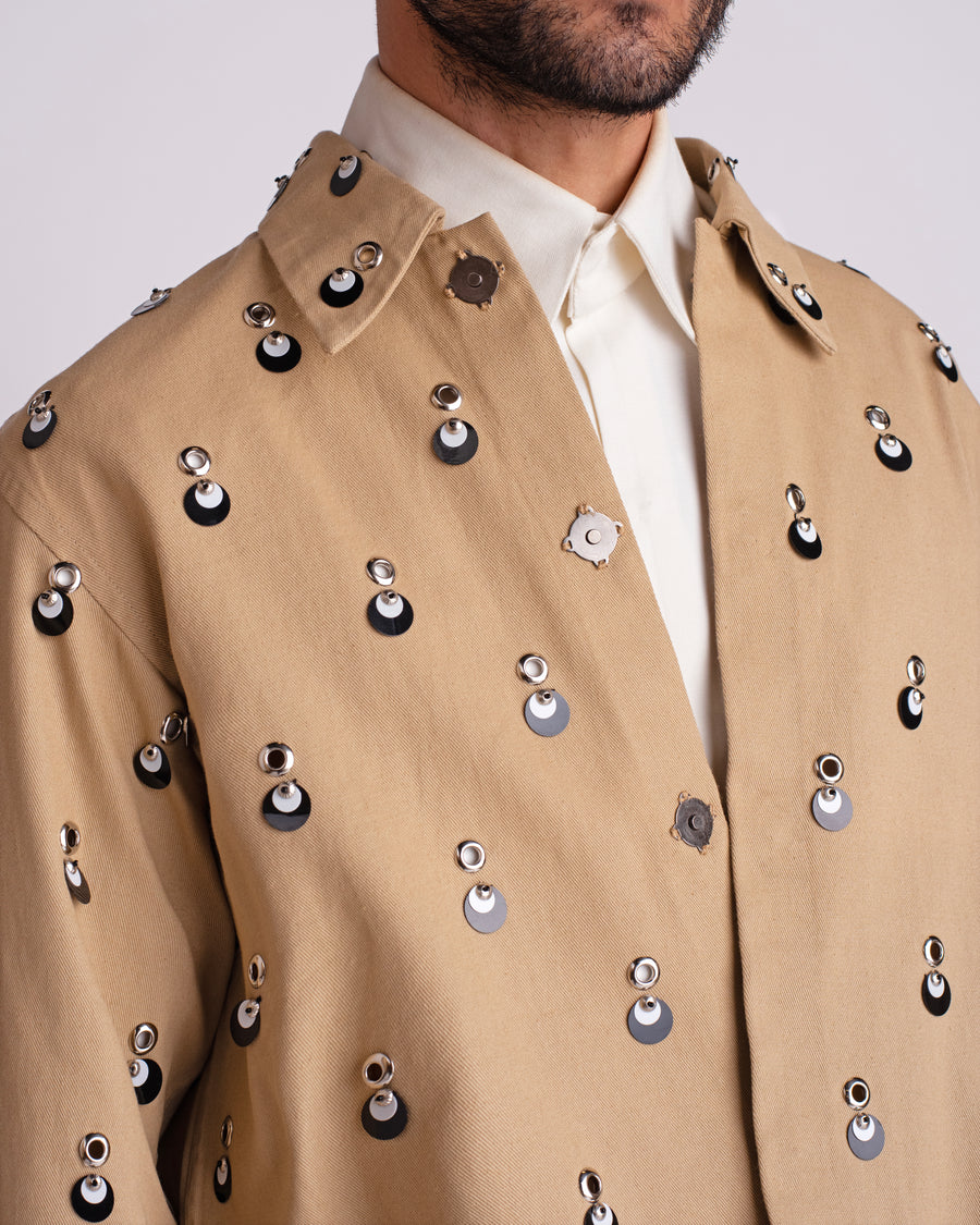ROSANI The Carter jacket in khaki. Close-up of metallic eyelet and sequin embellishment detail.