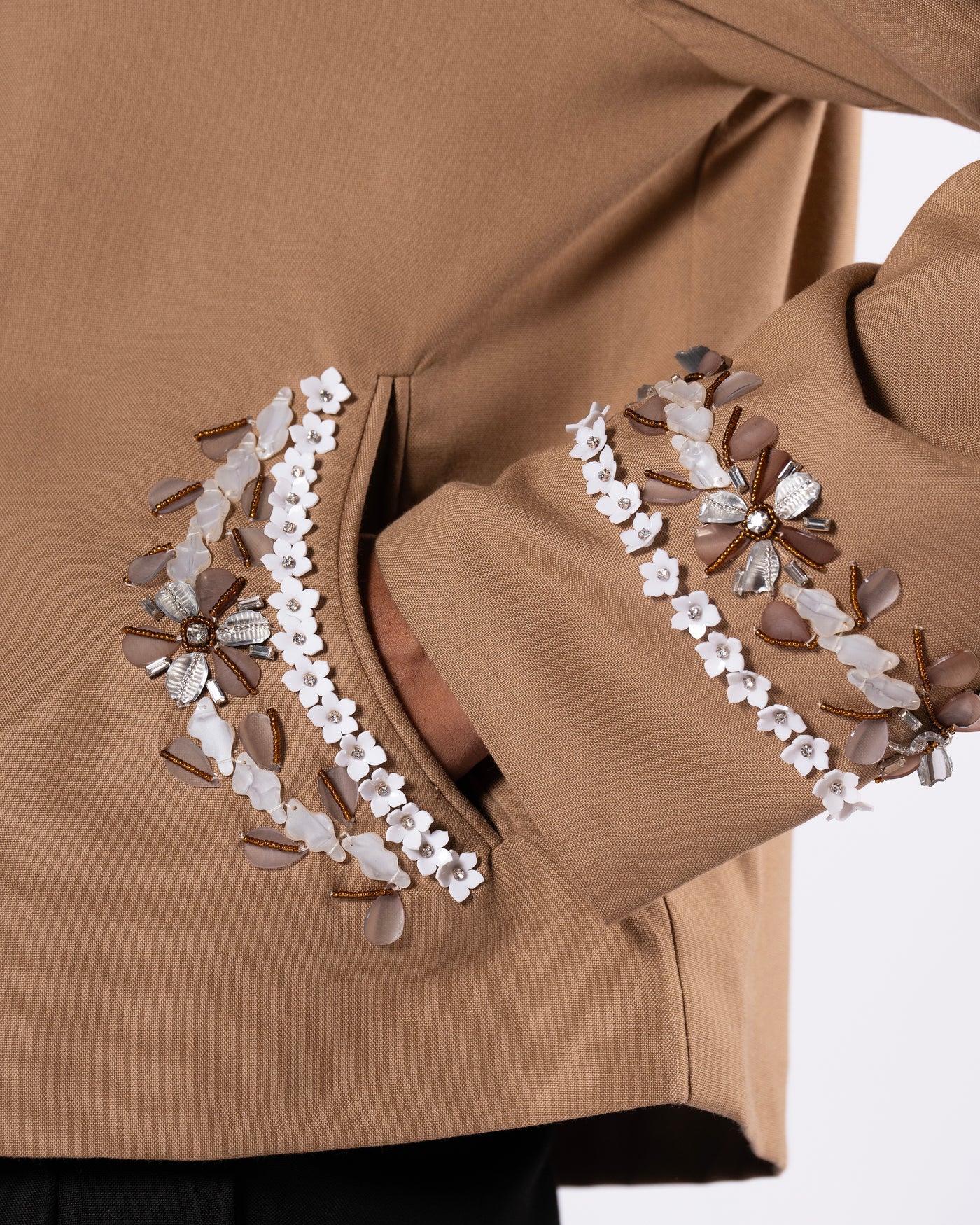 ROSANI The Darby jacket in khaki. Close-up of acrylic moulded flower and glass bead embellishment detail.