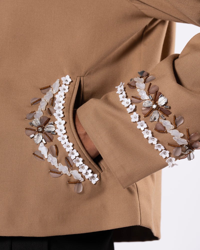 ROSANI The Darby jacket in khaki. Close-up of acrylic moulded flower and glass bead embellishment detail.