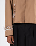 ROSANI The Darby jacket in khaki. Second detail view of floral surface coverage.