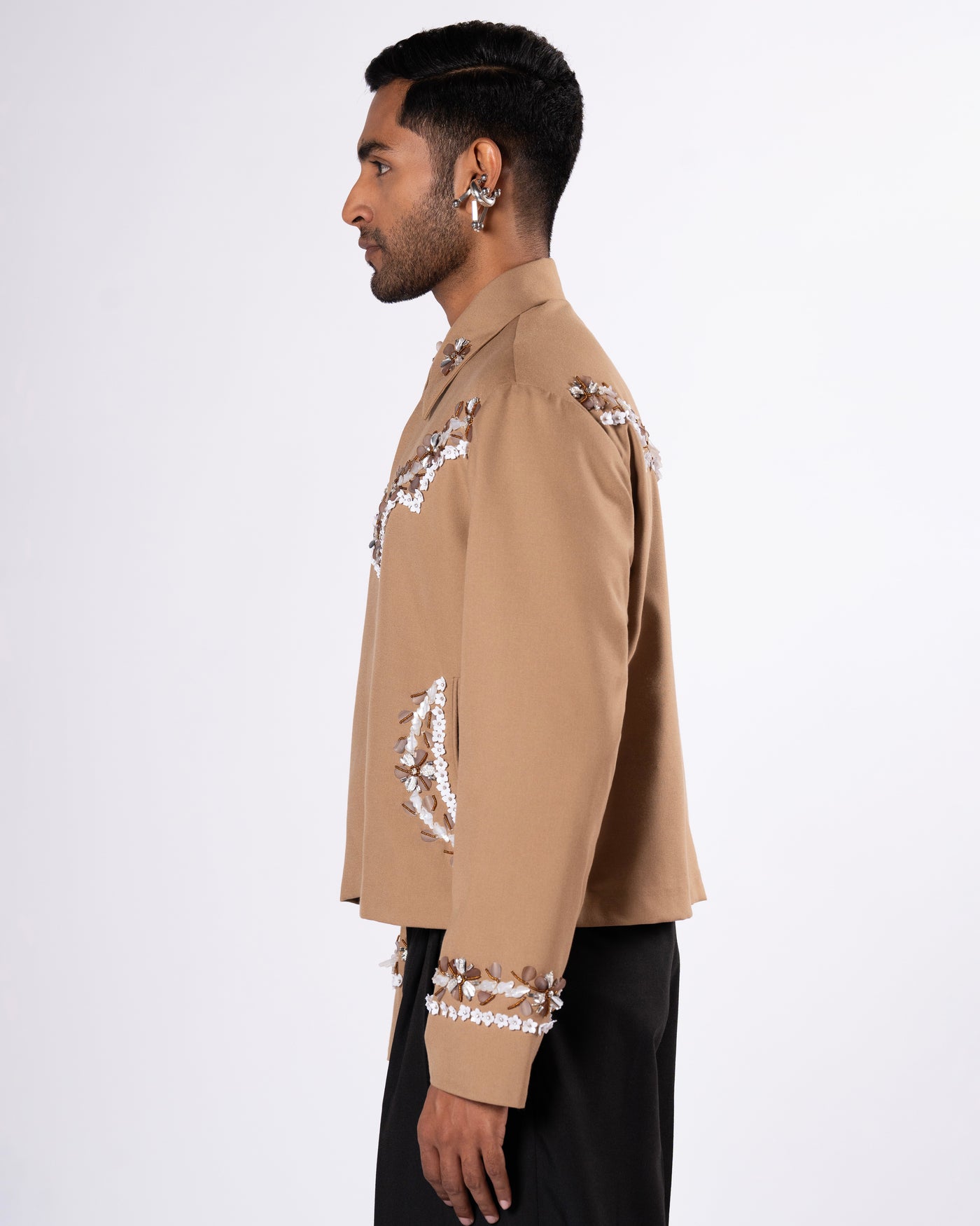ROSANI The Darby jacket in khaki. Side view showing full embellishment and silhouette. ANIMA and ANIMUS collection.
