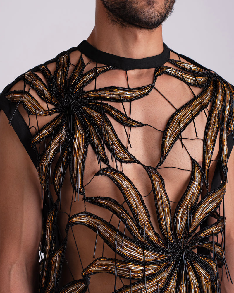 ROSANI The Monroe t-shirt. Close-up of Eclipsed Flora motif in gold, amber, silver and black glass bugles and beads, with suspended black bugles at centre.