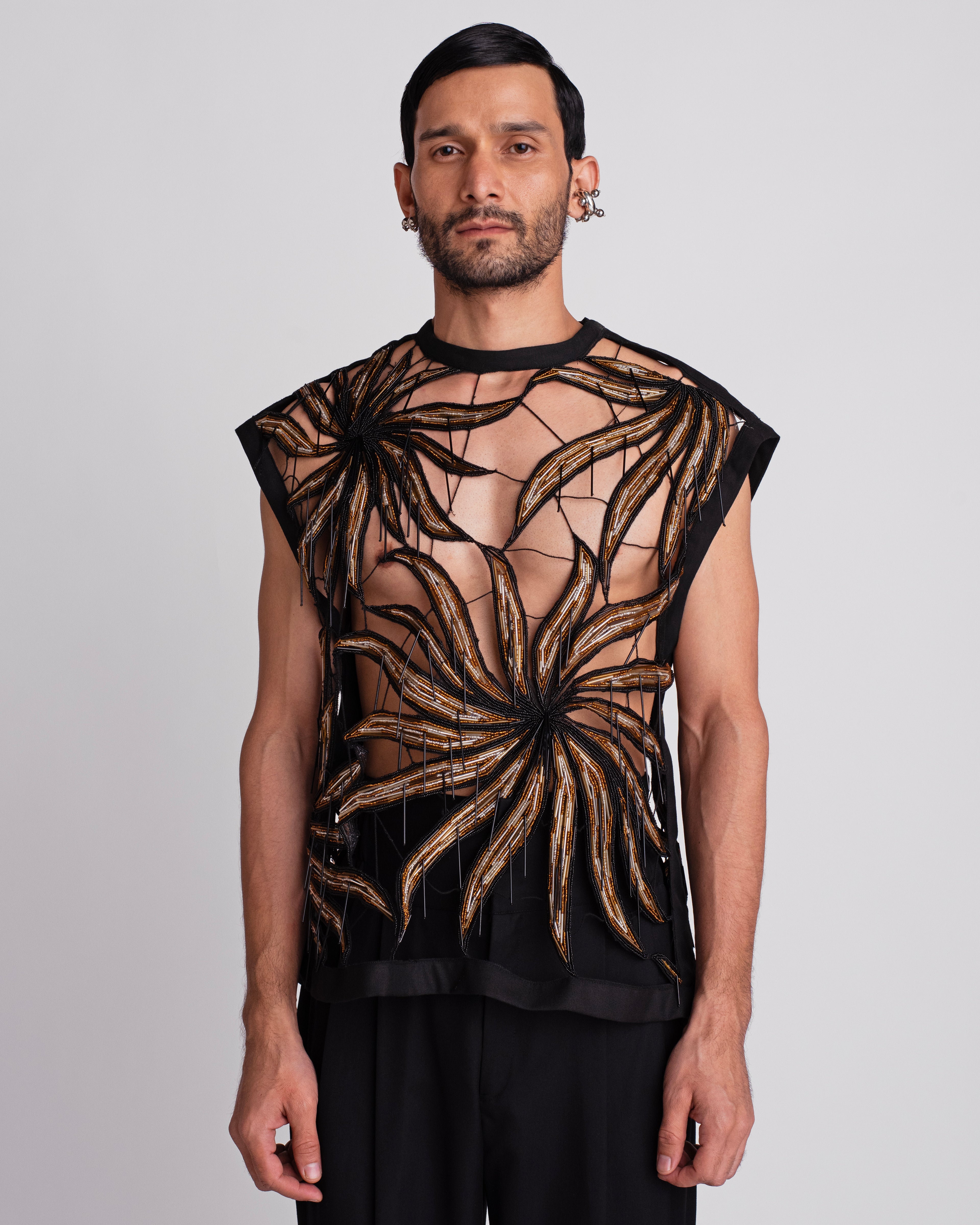ROSANI The Monroe t-shirt in black. Deconstructed sleeveless vest with Eclipsed Flora motif hand embroidered in glass bugles and beads. ANIMA and ANIMUS collection, front view.
