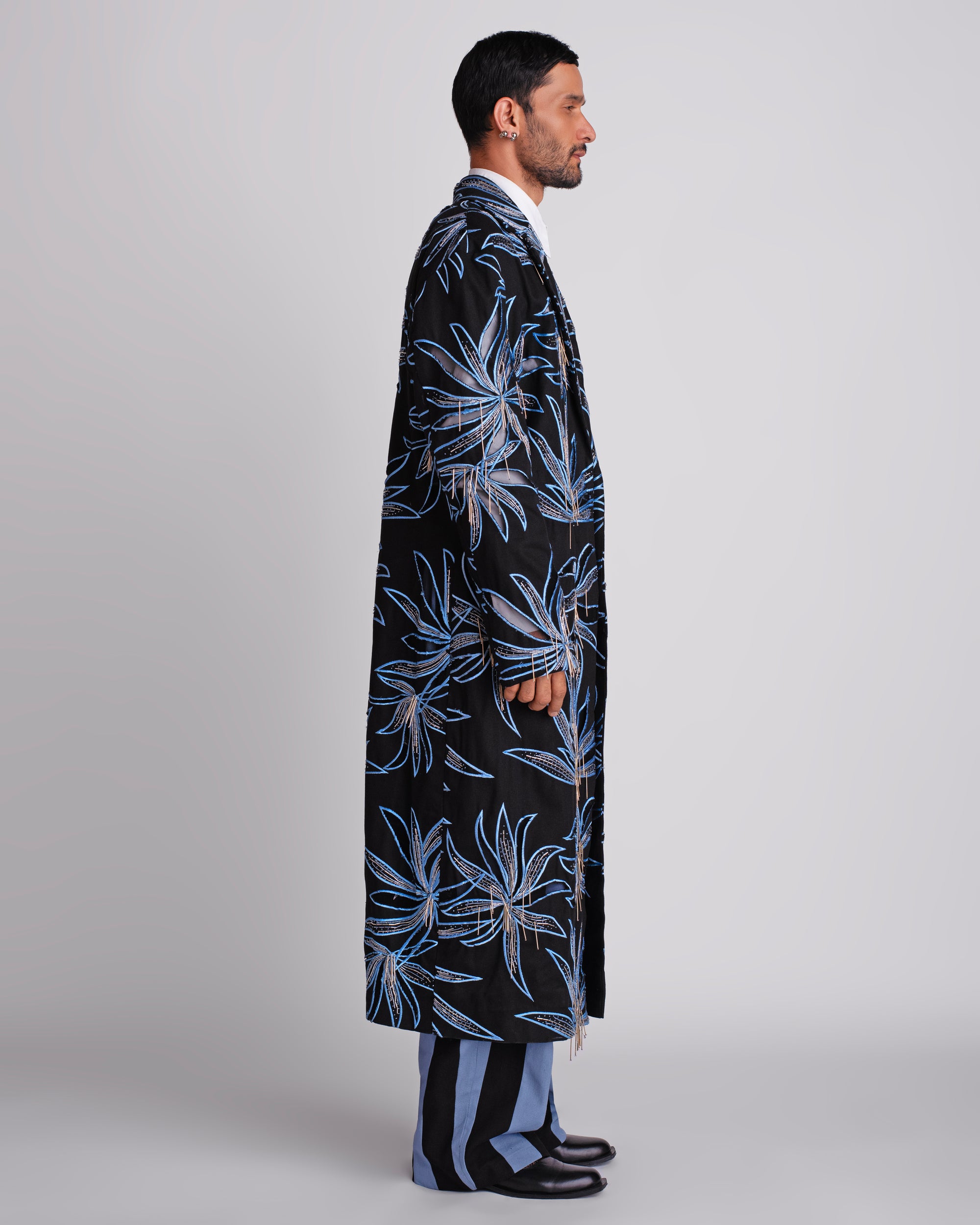 ROSANI The Noah coat in black. Side view showing tailored silhouette and embellishment movement.