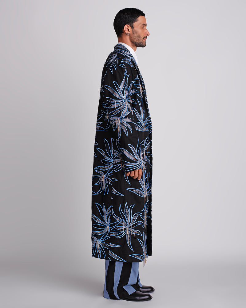 ROSANI The Noah coat in black - longline embellished evening coat with hand cutwork and blue thread embroidery, side view
