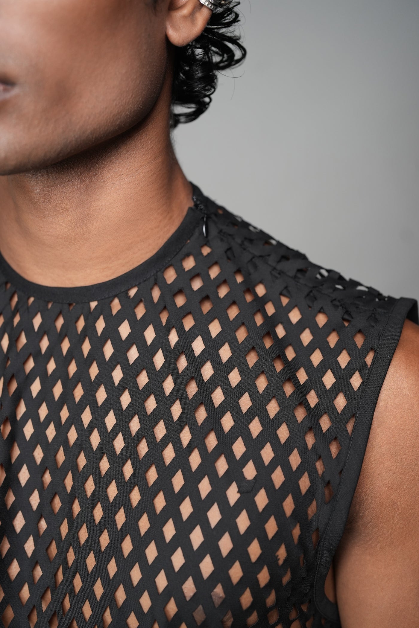 ROSANI The Void t-shirt in black - laser-cut net structure detail with shoulder zip, close-up