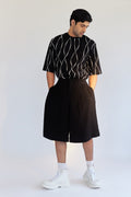 ROSANI The Le Huma short, three-quarter view. Relaxed fit through hip and thigh.