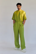 ROSANI The Theo trouser in chartreuse, side view. Silk wide-leg silhouette.