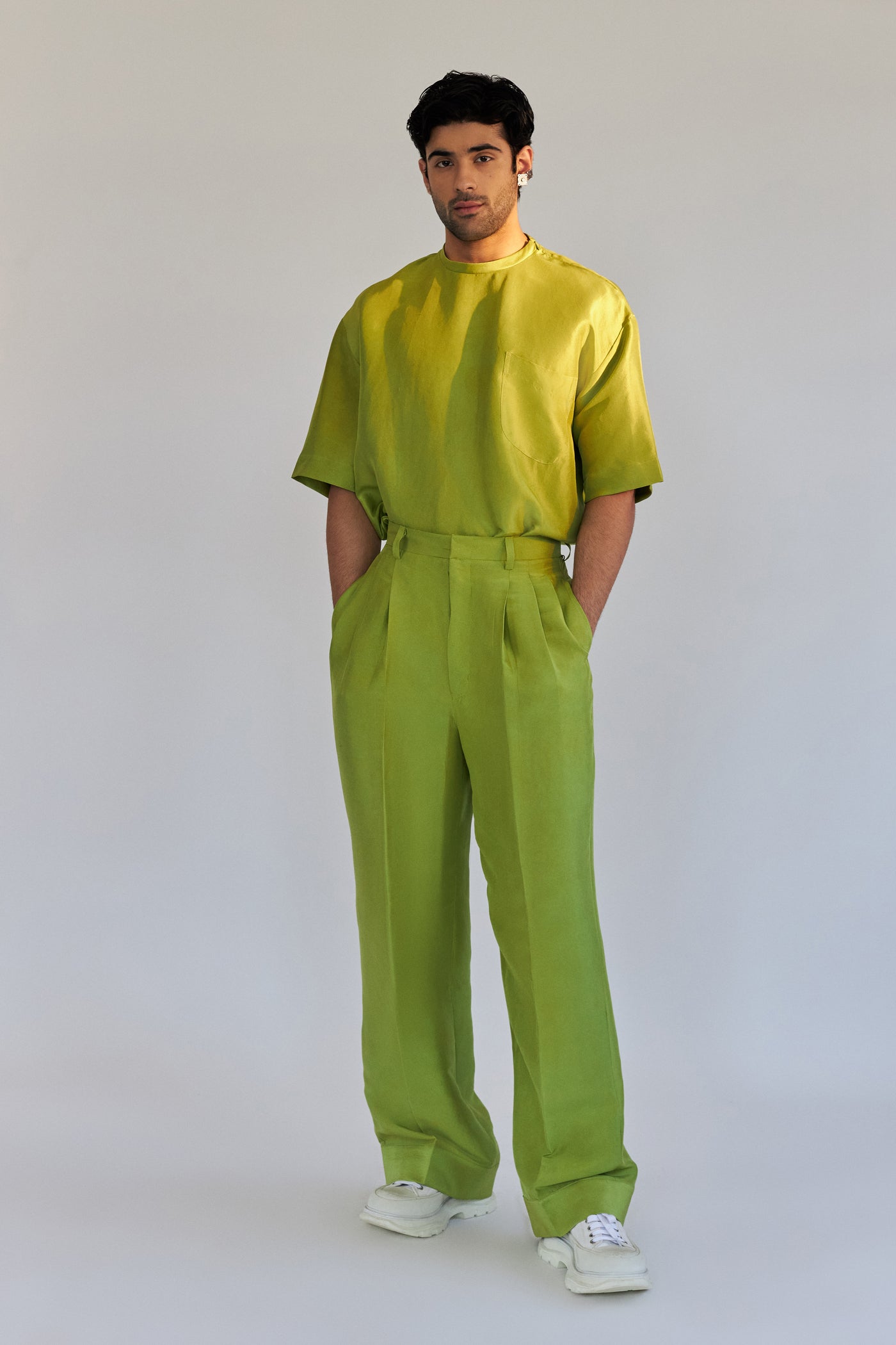 ROSANI The Theo trouser in chartreuse, side view. Silk wide-leg silhouette.