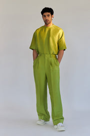 ROSANI The Theo trouser in chartreuse, side view. Silk wide-leg silhouette.