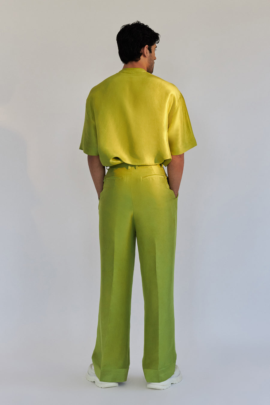 ROSANI The Theo trouser in chartreuse, back view. Pure silk wide-leg. DYMENSION collection.
