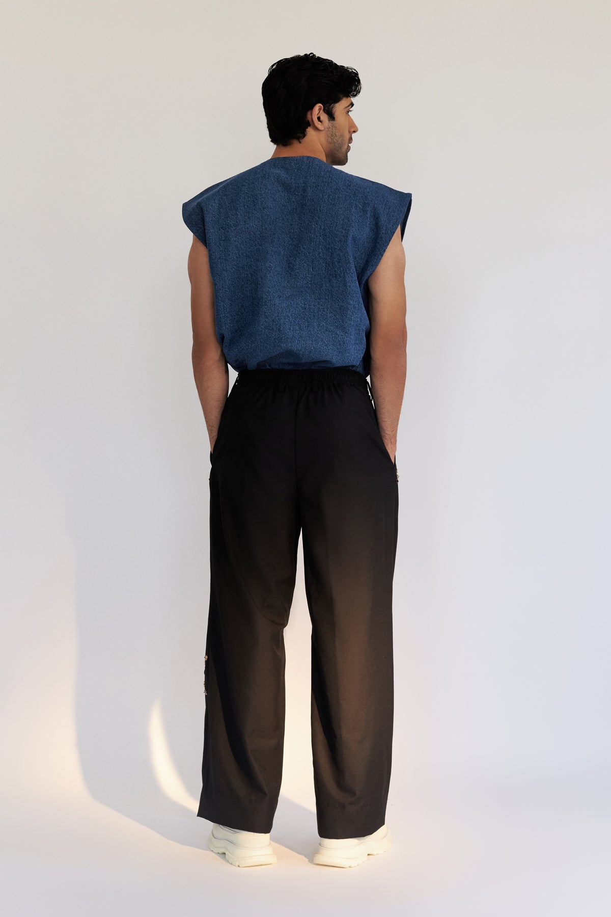 ROSANI The Orto trouser, full-length back view. DYMENSION collection.