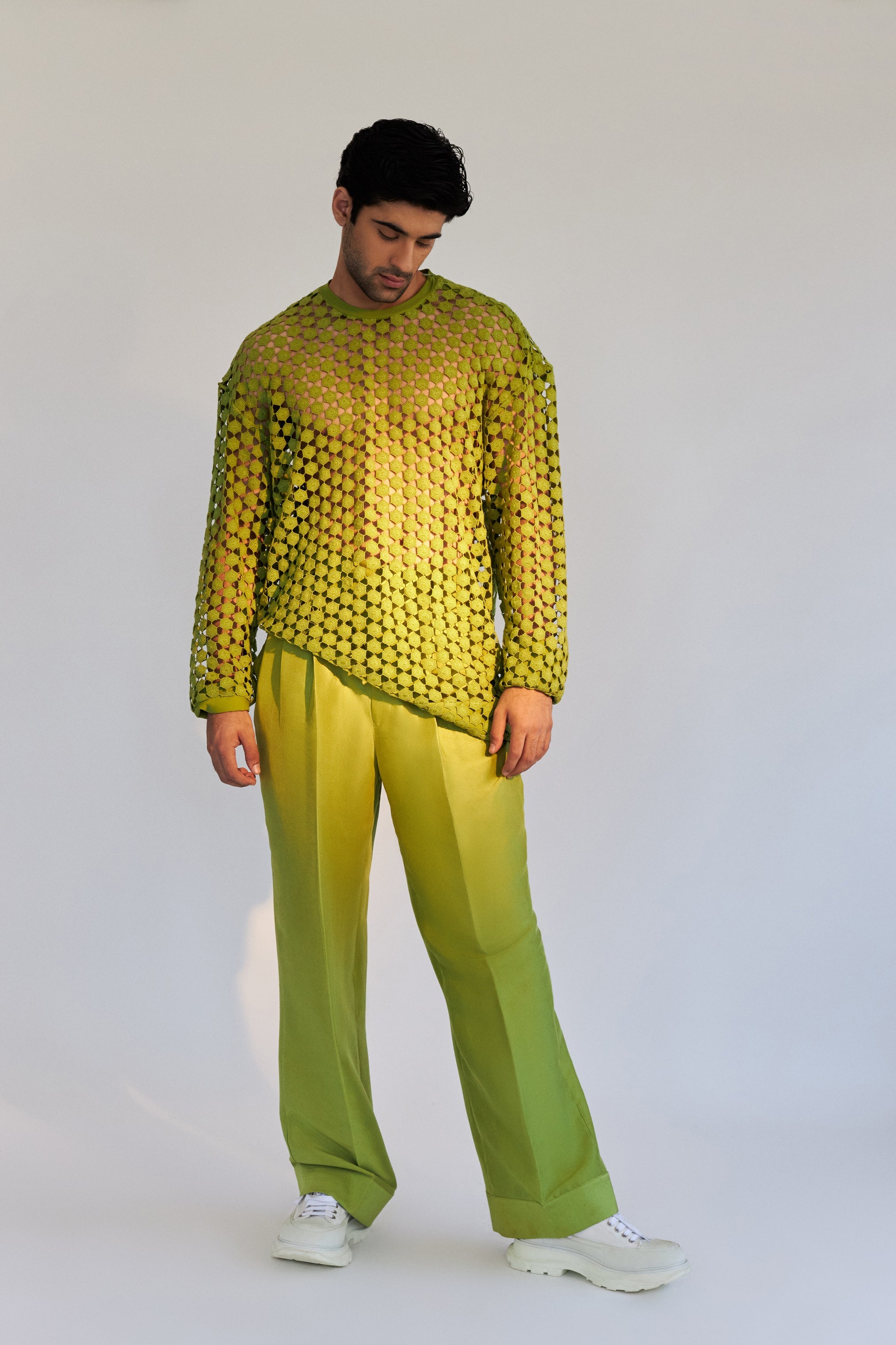 ROSANI The Ito sweater in chartreuse, front view. Oversized cotton with geometric open-work lace structure and signature shoulder zip. DYMENSION collection.