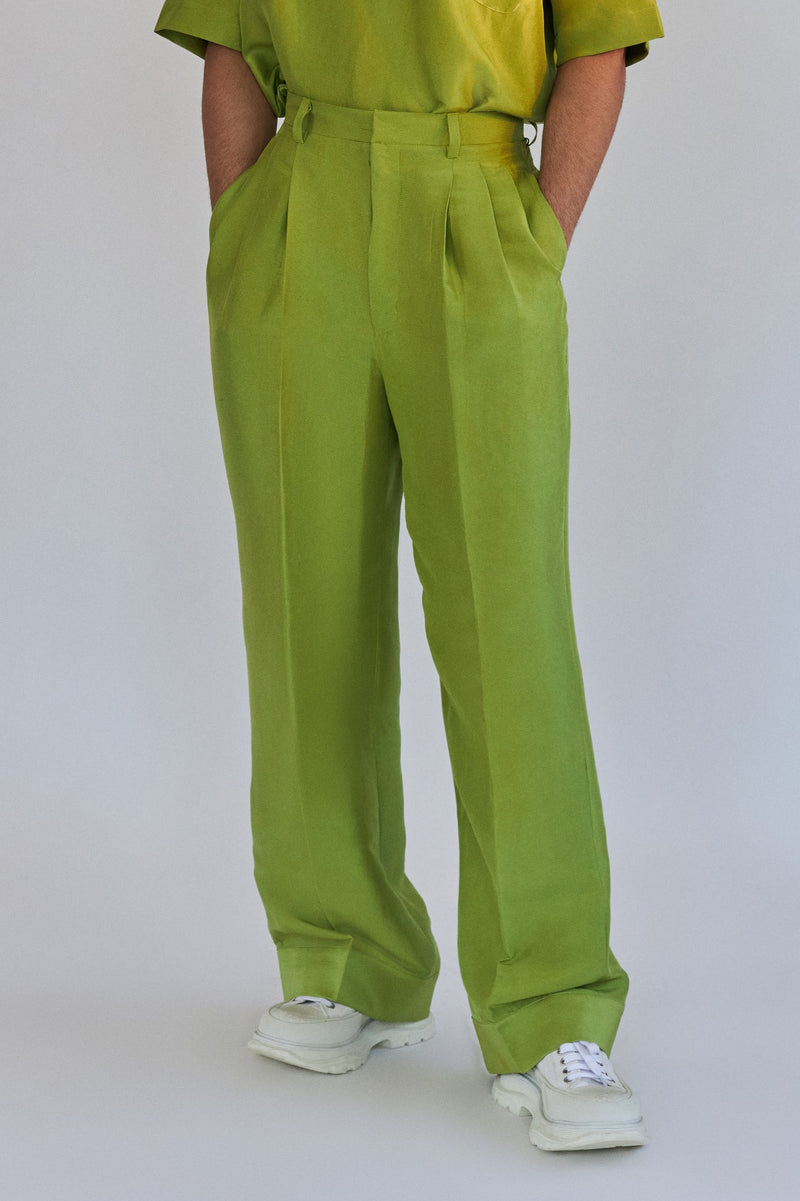ROSANI The Theo trouser in chartreuse, front view. Wide-leg silk with front pleats. DYMENSION collection.