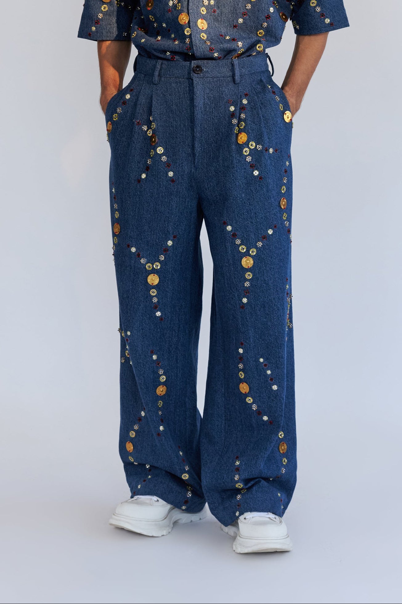 ROSANI The Enzo trouser, front view. Wide-leg denim with Auratus metallic disc embroidery. DYMENSION collection.