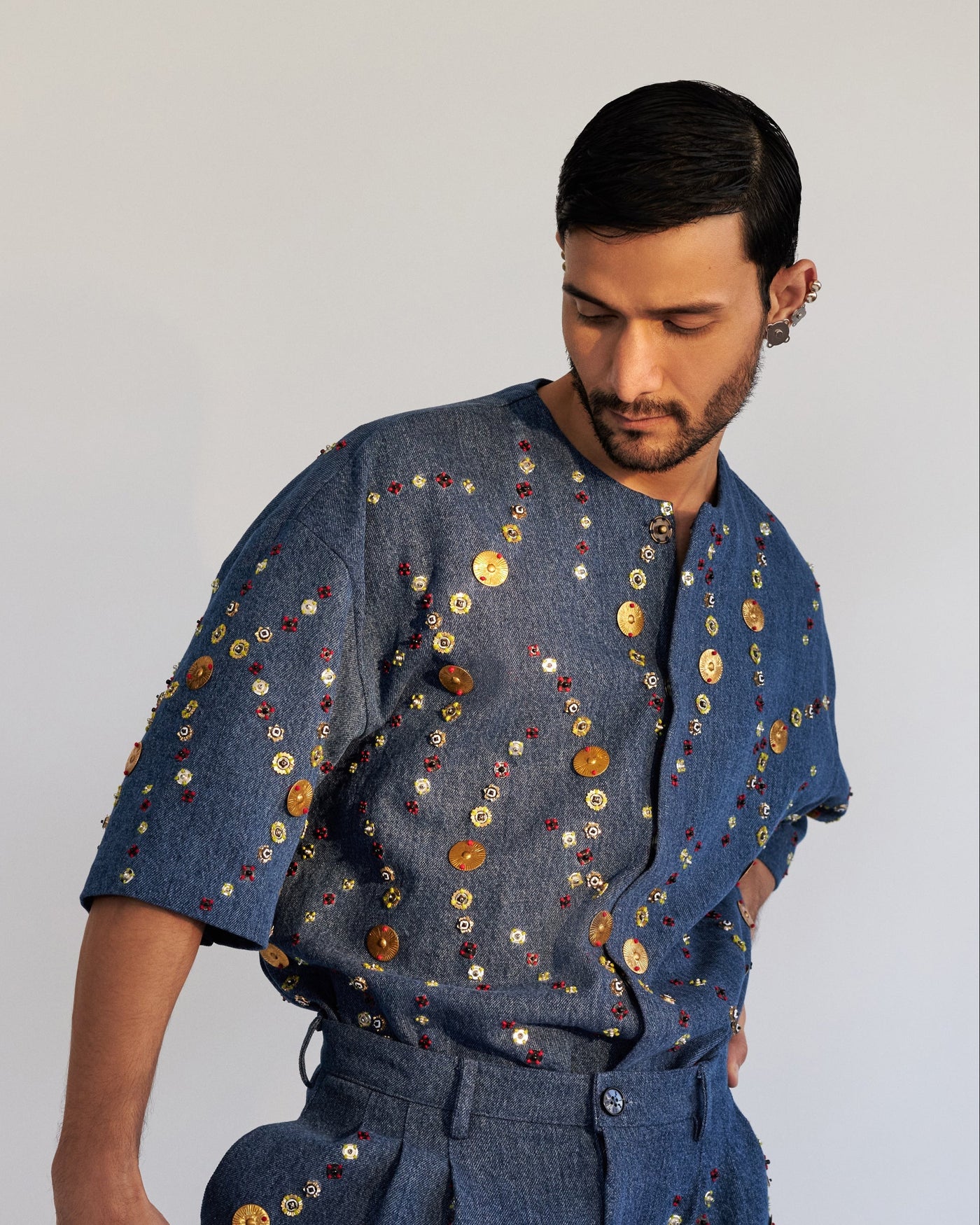 ROSANI The Atto shirt, front view. Boxy denim with all-over metallic disc and bead hand embroidery. DYMENSION collection.