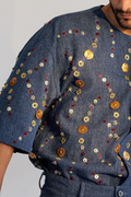 ROSANI The Atto shirt, close-up detail of overlapping metallic discs and mixed bead embroidery on denim.