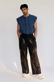 ROSANI The Orto trouser, detail of mixed metallic hand embroidery on black fabric.